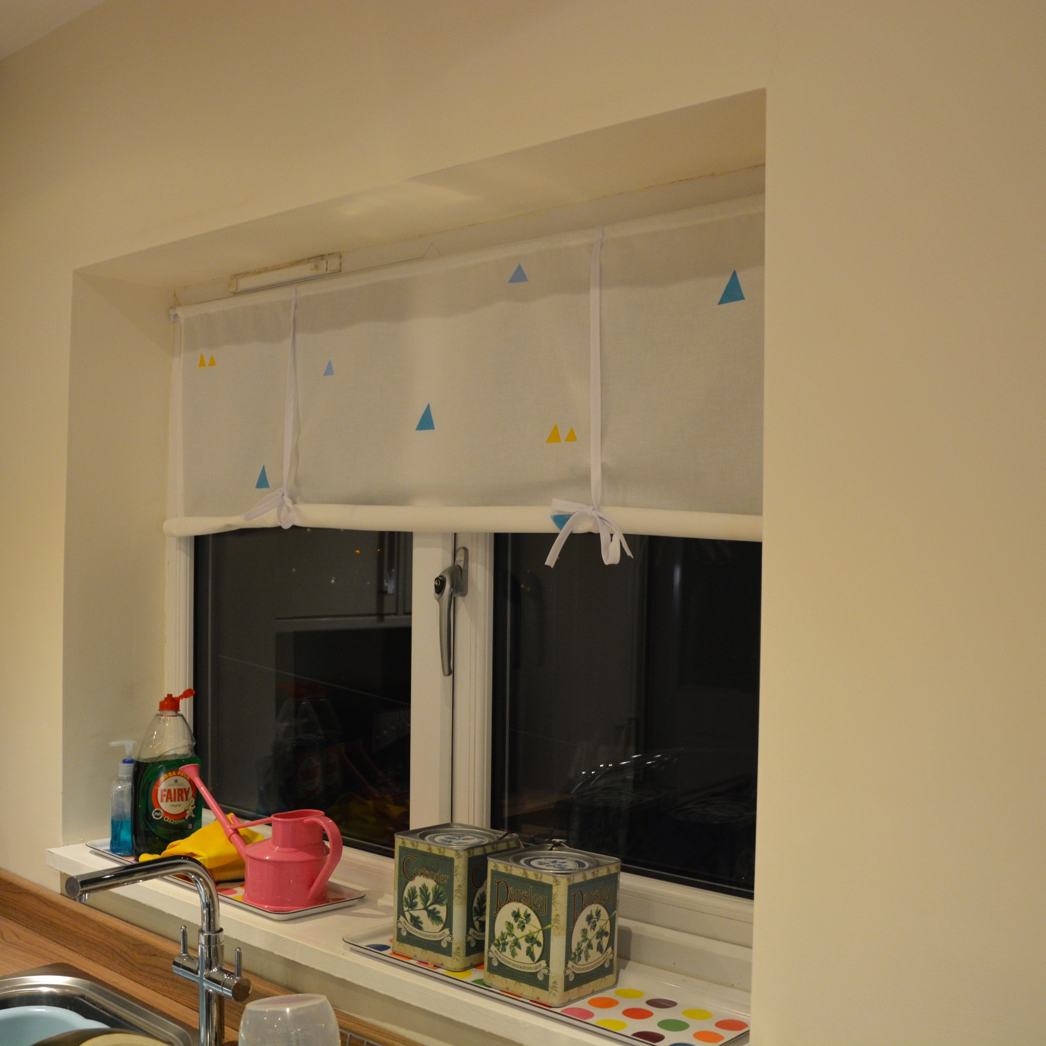 Large window blind rolled up | Hello! Hooray!