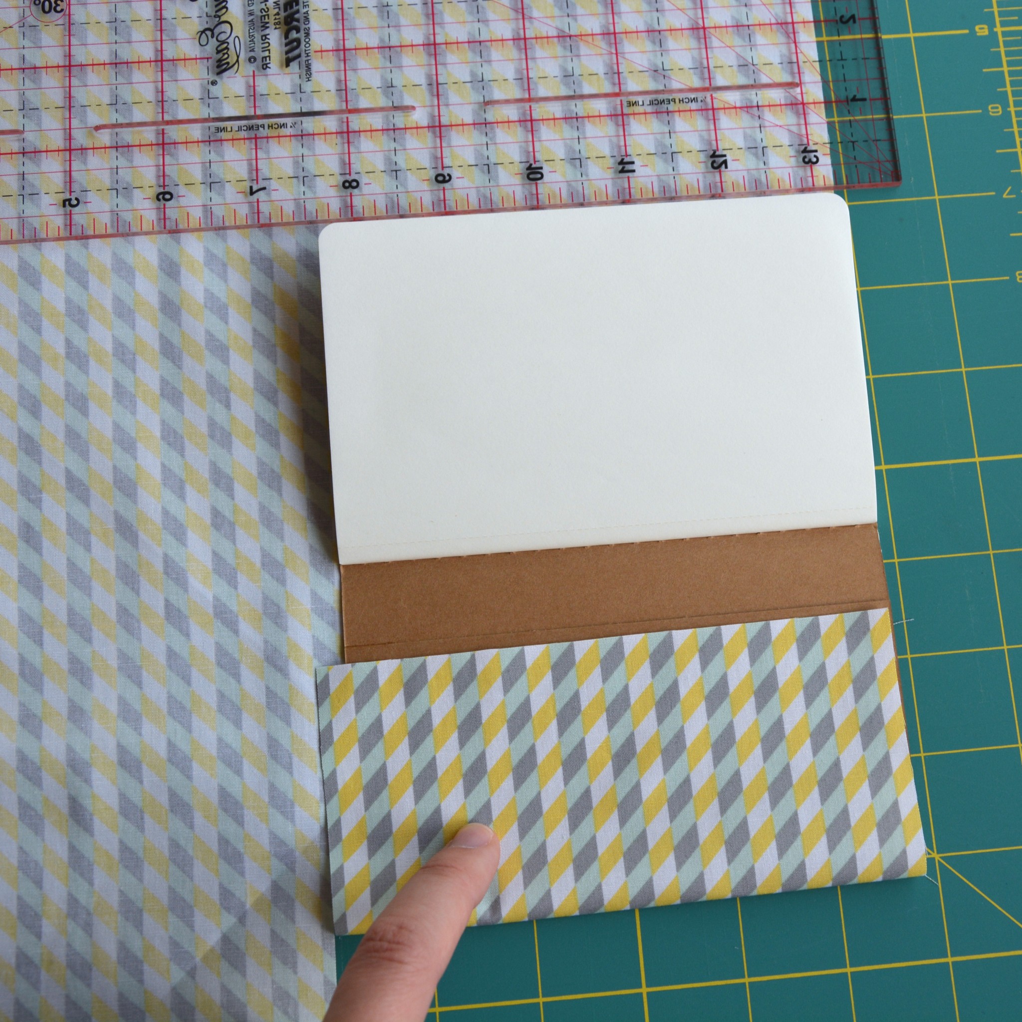 Measuring the fabric for the notebook
